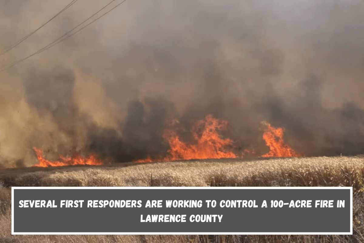 Several first responders are working to control a 100-acre fire in Lawrence County