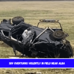 SUV overturns violently in field near Alba